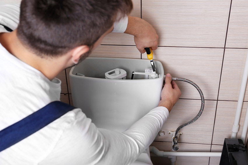 Plumber Installing A Toilet � Plumber To Your Door in Jensen, QLD