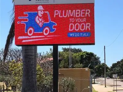 Plumber repairing pipes in Townsville home